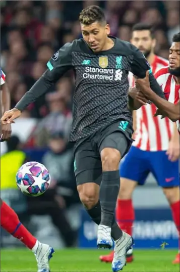  ??  ?? Liverpool’s Roberto Firmino in action against Atletico Madrid.