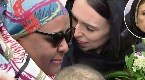  ??  ?? ardern, right, hugs and consoles a woman as she visited Kilbirnie Mosque to lay flowers among tributes to christchur­ch attack victims, in Wellington, New Zealand. — Photos: aP