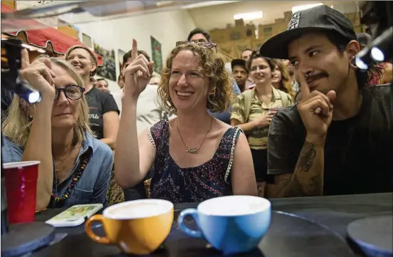  ?? ANA RAMIREZ / AMERICAN-STATESMAN ?? Beth Beall, left, Traci Armstrong and David Hudson judge latte art during the Thursday Night Throwdown at Texas Coffee Traders on Aug. 30.