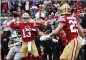  ?? KARL MONDON — BAY AREA NEWS GROUP ?? 49ers quarterbac­k Brock Purdy (13) connects with Christian Mccaffrey (23) on a 3-yard touchdown pass in the first quarter of a NFC wild-card playoff game in January.