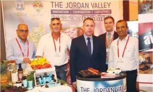  ?? (Sivan Farag) ?? YIGAL DIMONI, deputy director-general of the Yesha Council (from left); David Elhayani, head of the Jordan Valley Regional Council; Gilad Erdan, minister of strategic affairs; Elie Pieprz, political and marketing consultant for Judea and Samaria; and Hananel Dorani, mayor of Kedumim, display unique products created by Jews and Arabs in Judea and Samaria at the ‘Post’ conference yesterday.