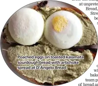  ??  ?? Poached eggs on toasted kalamata sourdough bread with artichoke spread at D’Angelo Bread.