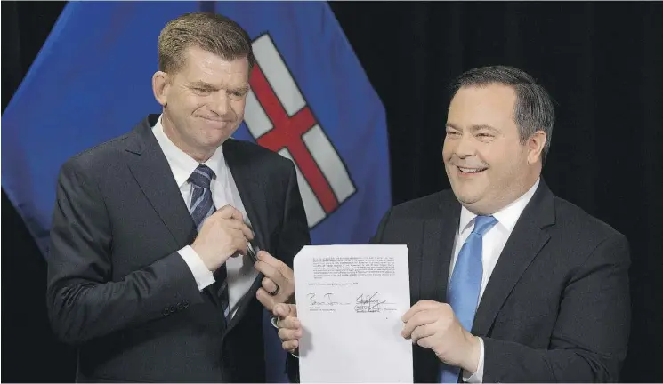  ?? DAVID BLOOM ?? Wildrose Leader Brian Jean, left, and PC Leader Jason Kenney announced Thursday that they had reached a deal to merge their parties.