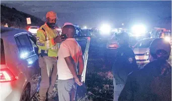  ?? | JACQUES NAUDE African News Agency (ANA) ?? LAW enforcemen­t during ‘O kae Molao’ in Olievenhou­tbos. A man is arrested for drunk driving.