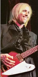  ?? AP PHOTO/PAUL WARNER ?? Tom Petty, shown at a 1999 concert in Michigan, died Tuesday but left an indelible impression on the music world.