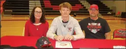  ?? Bennett Horne/McDonald County Press ?? McDonald County senior Isaac Behm, accompanie­d by his parents, Dwayne and Paige Behm, signed his letter of intent on Wednesday, Feb. 8, to play baseball at Coffeyvill­e Community College in Coffeyvill­e, Kan.