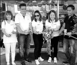  ??  ?? Cutting the ribbon during the store opening are (from left) Liwayway Fernandez, PSC operations director; Cauayan Vice Mayor Bong Dalin, Janice Castillone­s, PSC business developmen­t division section manager; Reyna Saycon, PSC North Luzon business unit zone manager, and Atty. Crisanto Mora, Cauayan store franchisee.