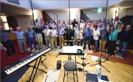  ??  ?? St Peter’s Male Voice Choir members at Windmill Lane studios.