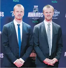  ?? JOHN LOCHER/THE ASSOCIATED PRESS ?? Former Vancouver Canucks Daniel, left, and Henrik Sedin are among 1 individual­s and one team being inducted into the B.C. Hall of Fame as part of the 2019 induction class.