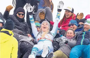  ?? JEAN-CHRISTOPHE BOTT/KEYSTONE ?? Lindsey Vonn celebrates after winning the bronze medal in the women’s downhill race at the alpine ski World Championsh­ips in Åre, Sweden on Sunday.