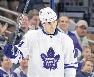  ?? AP PHOTO ?? In this March 16 file photo, then-toronto Maple Leafs centre Brian Boyle waves to the crowd as the Tampa Bay Lighting play a video tribute to Boyle during the first period of an NHL game in Tampa, Fla.