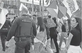  ?? PROVIDED BY FLORIDA ATLANTIC UNIVERSITY PRESS ?? A pro-Palestinia­n march last October at Florida Atlantic University’s campus was organized by the FAU Muslim Student Associatio­n. It included about 100 protesters and ultimately was met with counterpro­testers, resulting in three arrests.