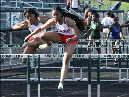  ?? PHOTOS BY MATTHEW MOWERY — MEDIANEWS GROUP ?? Oak Park hurdlers (from left) Drelin Mapp, Nonah Waldron and Morgan Roundtree swept the top three spots in the 100 hurdles event at the OAA Blue/Gold Championsh­ips at West Bloomfield on Thursday helping the Knights win their ninth straight Blue/Gold title.