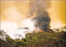  ?? Noah Berger Associated Press ?? THE KNP COMPLEX in Sequoia National Park has burned 8,940 acres, encroachin­g on the thousands of sequoias in the Giant Forest.