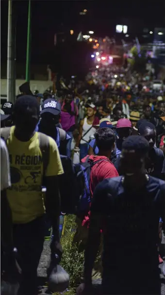  ?? AP FILE ?? MASSES: Migrants from Africa, Cuba, Haiti, and other Central American countries set off early morning by foot from to the southern border of the United States from Tapachula, Mexico, in 2019.