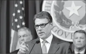  ?? AP/ERIC GAY ?? Texas Gov. Rick Perry speaks at a news conference Monday in the governor’s press room in Austin, Texas.