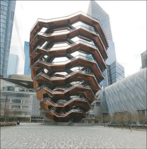  ?? LUIZ C. RIBEIRO FOR NYDN ?? The Vessel pedestrian installati­on at Hudson Yards closed three years ago after four people jumped to their deaths. It will reopen this year after being retrofitte­d with protective mesh steel fencing.