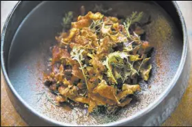  ??  ?? Maitake “hen of the woods” mushrooms are served with baked Turkish hummus, crispy sunchokes and cascabel chile.
