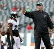  ?? MICHAEL PEREZ — THE ASSOCIATED PRESS ?? Philadelph­ia Eagles head coach Doug Pederson walks the field before Thursday’s preseason game against the Buffalo Bills.