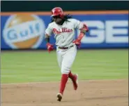  ?? FRANK FRANKLIN II — THE ASSOCIATED PRESS ?? Philadelph­ia Phillies’ third baseman Maikel Franco gestures to teammates as he runs the bases after hitting a threerun home run during the second inning against the New York Mets on Tuesday in New York.