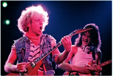  ?? ?? Hagar and Eddie Van Halen rip it up in the 1980s, above.