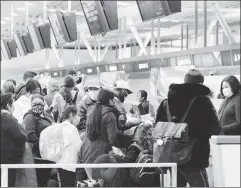  ?? ?? Media miss: The big holiday-travel story was how many Americans flew despite rising COVID cases, as seen at John F. Kennedy airport Dec. 26.