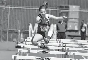  ?? GREG MCNEIL/CAPE BRETON POST ?? Cape Breton’s MacKenzie Roach clears a hurdle during the 2018 Nova Scotia Schools Athletic Federation Track and Field Championsh­ip at Cape Breton University on Friday. Roach was competing in the girls 80-metre hurdles 33” division.