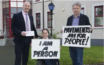  ??  ?? Maria McCabe outside Drogheda Garda Station with the Mayor of Drogheda Cllr. Pio Smith and disability activist Michael O’Dowd