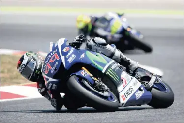  ?? PICTURE: AP ?? After his latest win in Spain, Lorenzo trails Rossi by just one point.