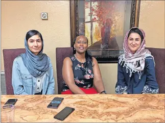  ??  ?? From left, Nazila Kakar, Chantal Munanayire and Hasina Almag recently traveled to Oklahoma for business leadership and mentorship training provided through the state-based Institute for the Economic Empowermen­t of Women. [PROVIDED]