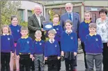 ??  ?? Malcolm Macdonald, left, handing over the new Iolaire book to pupils of Laxdale School. Also pictured are Councillor Angus McCormack and Mairi Macleod, Laxdale head teacher.