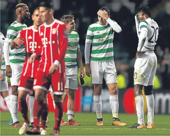  ?? Picture: Getty Images. ?? Disappoint­ment for Celtic’s players as their Champions League hopes are ended by the final whistle.