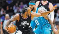  ?? Nell Redmond
The Associated Press ?? Clippers star Kawhi Leonard has been sidelined with “very, very stubborn inflammati­on” in his surgically repaired right knee.