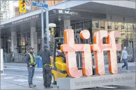  ?? CP PHOTO ?? A sign bearing the Toronto Internatio­nal Film Festival logo sits on a fork lift as preparatio­ns are made for the festival’s opening night. As the festival prepares to kick off today, it’s doing so in a changed landscape i the #Metoo era.