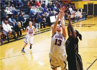  ??  ?? Red Bank’s Haley Claiborne (13) shoots over Tyner’s Keniah Watkins.