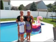  ?? KOLLEEN LONG — DIGITAL FIRST MEDIA ?? This backyard pool in Blandon is a favorite spot for Brenda Ponciano (front right), from Queens, New York. For the past four years, Brenda has visited the Daczewitcz family including (from left) Jackie, Bridgette and Brooke, as a participan­t in the...