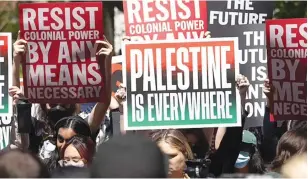  ?? ?? A group of NYU students, faculty and supporters hold pro-Palestine posters during a rally held in Washington Square Park