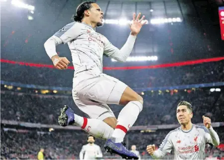  ?? EPA ?? Luftsprung in der Münchner Allianz-Arena: Liverpools Torschütze Virgil van Dijk freut sich über sein Goal.