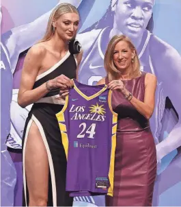  ?? BRAD PENNER/USA TODAY SPORTS ?? Cameron Brink poses with WNBA Commission­er Cathy Engelbert after she is selected with the No. 2 pick by the Los Angeles Sparks.