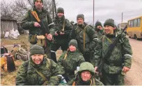  ?? ANNA ILYASOVA/THE NEW YORK TIMES ?? In an undated photo provided by Anna Ilyasova, center, she appears with other pro-Russian fighters from the east of Ukraine.