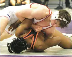  ?? SMIERCIAK/POST-TRIBUNE
JOHN ?? Crown Point’s Sam Goin, top, wrestles against LaPorte’s Noah Salary during the championsh­ip match in the 152-pound weight class at the Duneland Athletic Conference Meet.