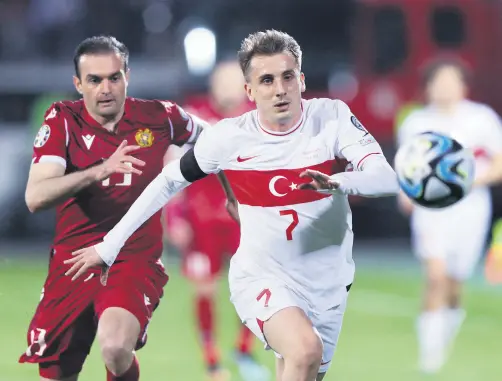  ?? ?? Armenia’s Kamo Hovhannisy­an (L) in action with Türkiye’s Kerem Aktürkoğlu at a UEFA Euro 2024 Qualifier, Yerevan, Armenia, March 25, 2023.