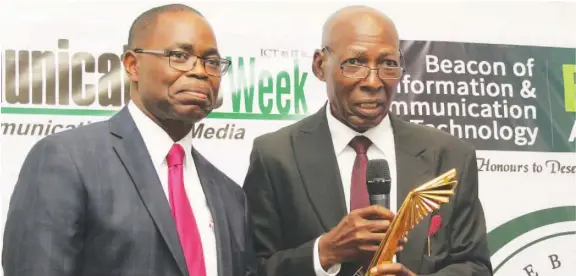  ??  ?? l-r: Dr. Jerr y Agbaike, of Ministry of Higher Education, Delta State receiving eGovernmen­t Leadership award from Mr. Chris Uwaje, chairman, Mobile Software Solutions Limited at the recent BoICT awards held in Lagos.