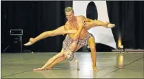  ?? Picture: SUPPLIED ?? WINNING TOUCH: Chace Collett,17, and dance teacher Ashley Behrens perform a dance routine together. The pair won the 2015 Senior Grand Champion Dance Group of the World award for their opening dance number at the World Championsh­ips for Performing Arts...