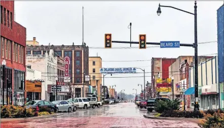  ?? [CHRIS LANDSBERGE­R PHOTOS/ THE OKLAHOMAN] ?? Many young profession­als are opening businesses to revitalize local economies in towns across the state of Oklahoma, such as along Main Street in Shawnee, shown here.