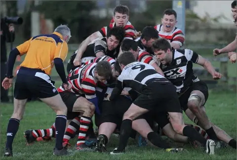  ??  ?? Despite Enniscorth­y’s best efforts, in this instance they were unable to prevent home side Dundalk from scoring a try on Saturday.