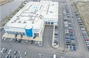  ?? AFP ?? Cars sit in the lot at the McGrath Honda dealership last month Elgin, Illinois. Covid-related plant shutdowns have caused shortages of new vehicles at dealership­s across the US.