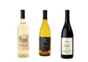  ?? BLOOMBERG PHOTO BY CAROLINE TOMPKINS ?? The 2016 Grower’s Reserve Sauvignon Blanc California (from left), 2016 Grand Reserve Sonoma Coast Chardonnay (Lot 87) and 2016 Reserve Petite Sirah Paso Robles (Lot 143) are some of the best Trader Joe’s brand wines.