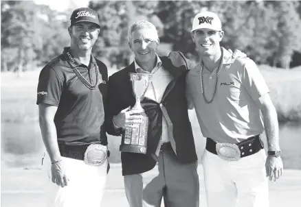  ?? THE ASSOCIATED PRESS ?? From left, Scott Piercy, PGA Tour commission­er Jay Monahan and Billy Horschel pose with the trophy Sunday after the Zurich Classic at TPC Louisiana in Avondale. Piercy and Horschel won the team-format tournament. Pat Perez and Jason Dufner were second.