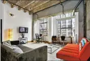  ?? Jo David ?? DOWNTOWN L.A.: Exposed concrete walls contribute to an industrial feel in this artsy loft.